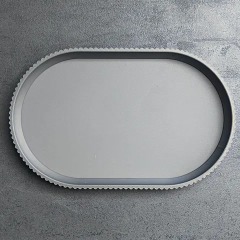 Schlüsselschale oval gerippt, flach von Slick: Schlüsselschale von oben auf der Küchenplatte, 3D-Druck aus mattem PLA in Grau