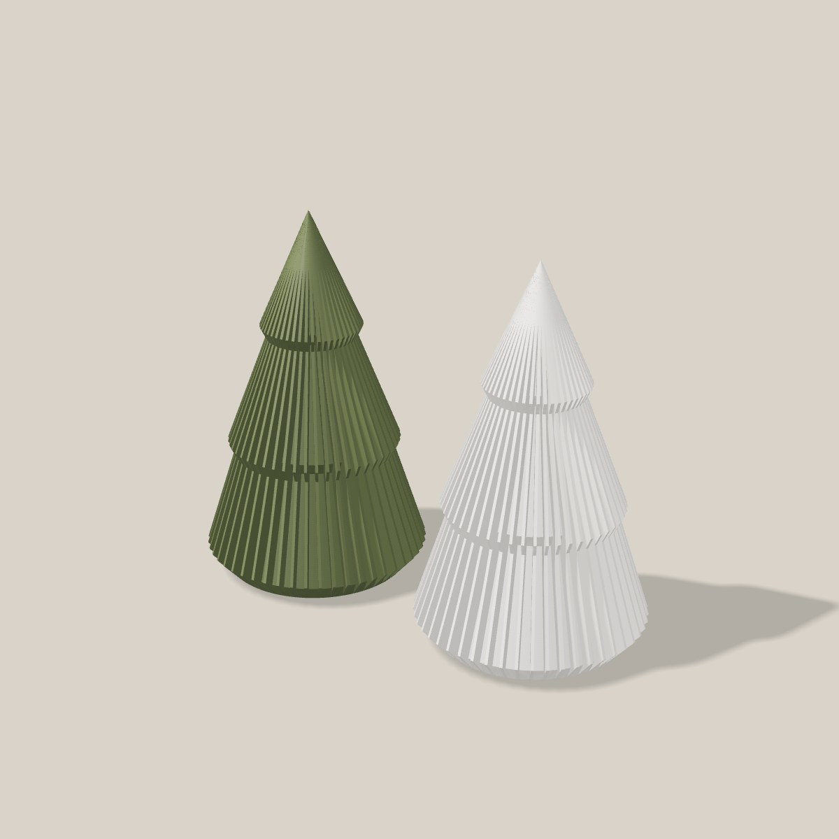 Mini-Tannenbaum in Dunkelgrün und Weiß nebeneinander